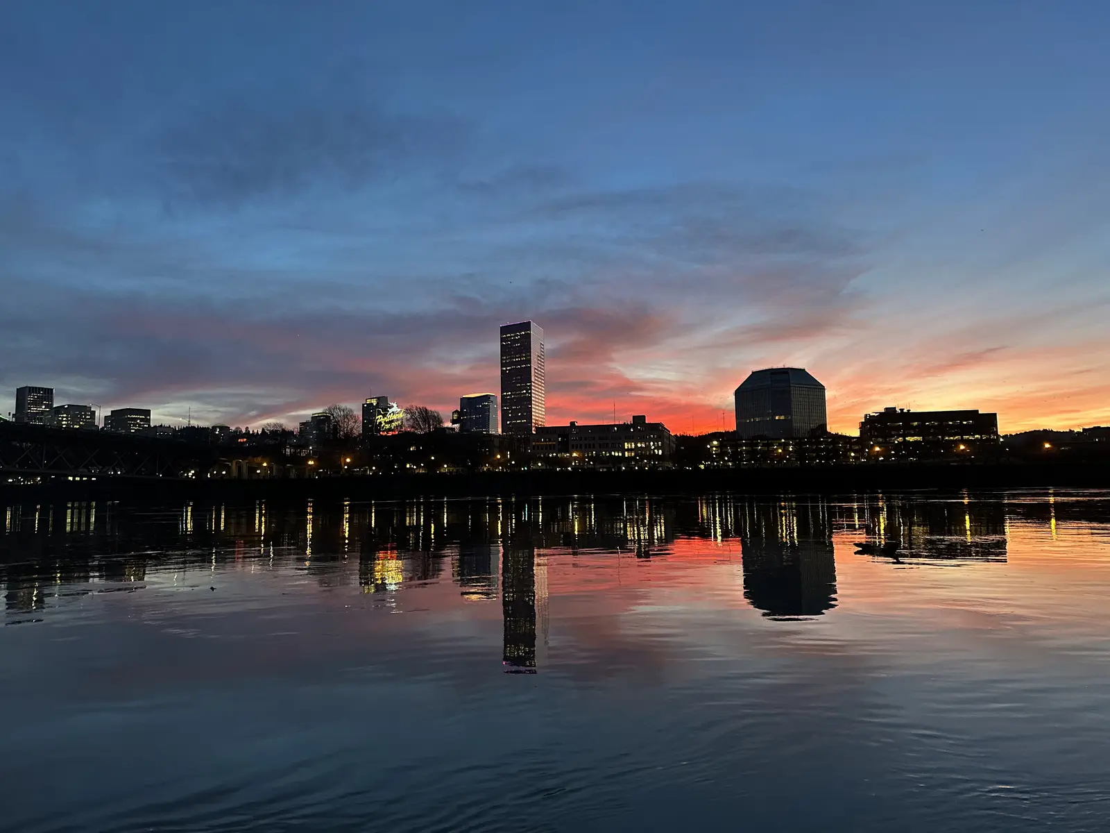 Downtown Portland, Oregon skyline at sunset reflected in the Willamette River